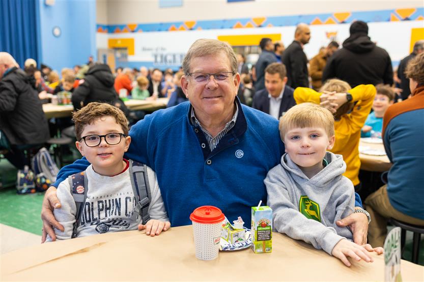 Trinity Elementary students eat donuts with dudes
